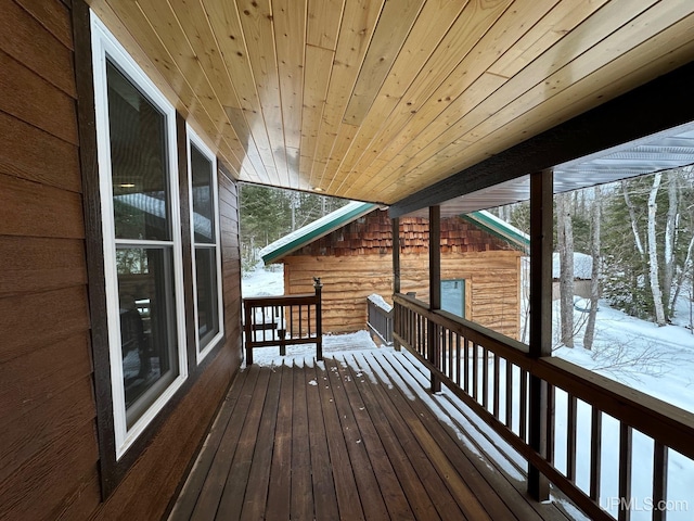 view of snow covered deck