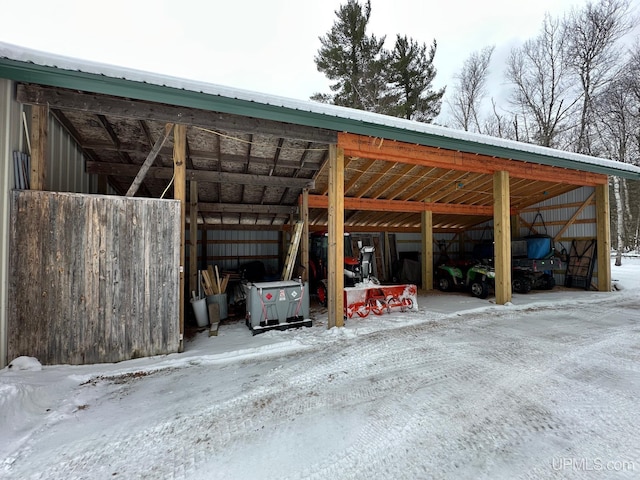 view of snow covered parking