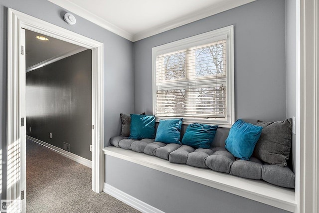 living area with ornamental molding and carpet floors