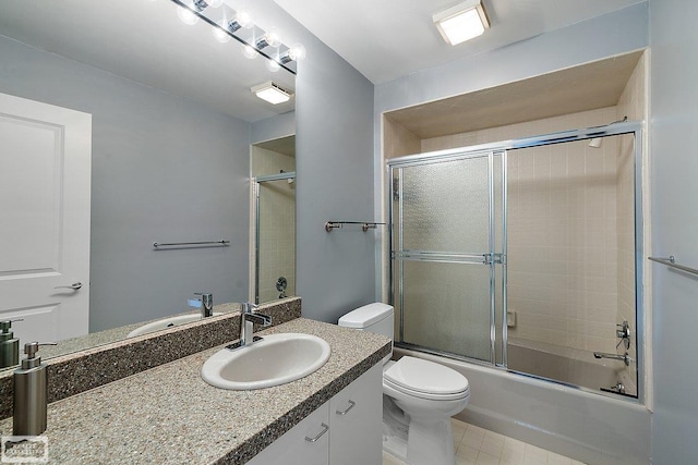 full bathroom featuring enclosed tub / shower combo, vanity, and toilet