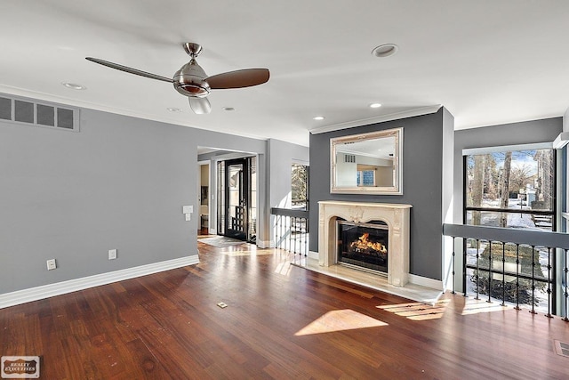 unfurnished living room with wood-type flooring and ceiling fan