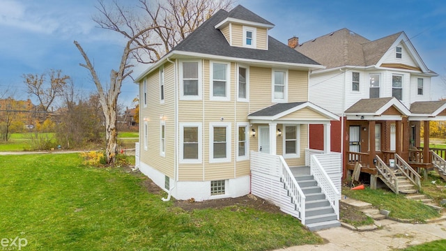 view of front of home with a porch and a front yard