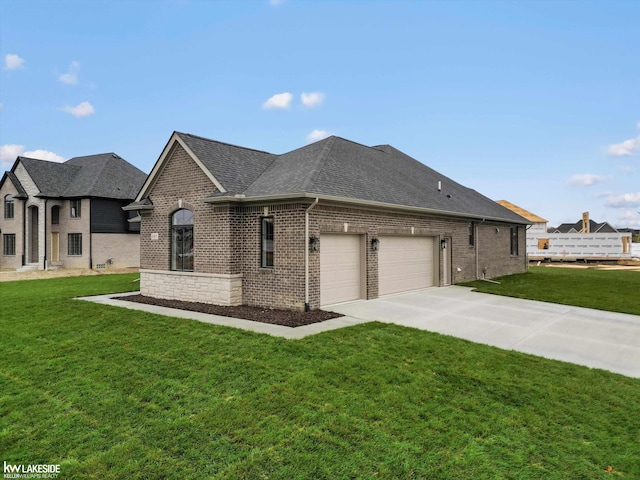 french provincial home with a garage and a front lawn