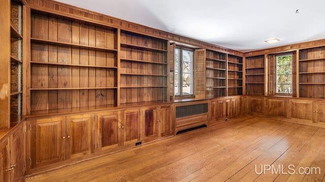 unfurnished living room with light wood-type flooring