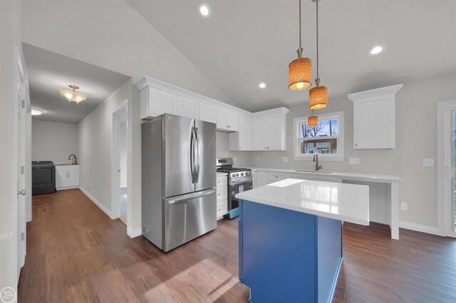 1834 Riley Rd, Saint Clair, MI 48079 - kitchen with white cabinetry, appliances with stainless steel finishes, sink, and a kitchen island
