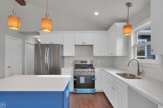 1834 Riley Rd, Saint Clair, MI 48079 - kitchen featuring white cabinetry, lofted ceiling, sink, hanging light fixtures, and stainless steel appliances