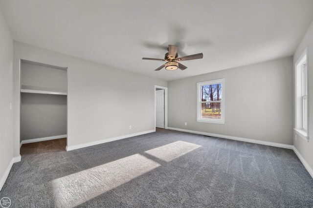 1834 Riley Rd, Saint Clair, MI 48079 - unfurnished bedroom with dark carpet and ceiling fan