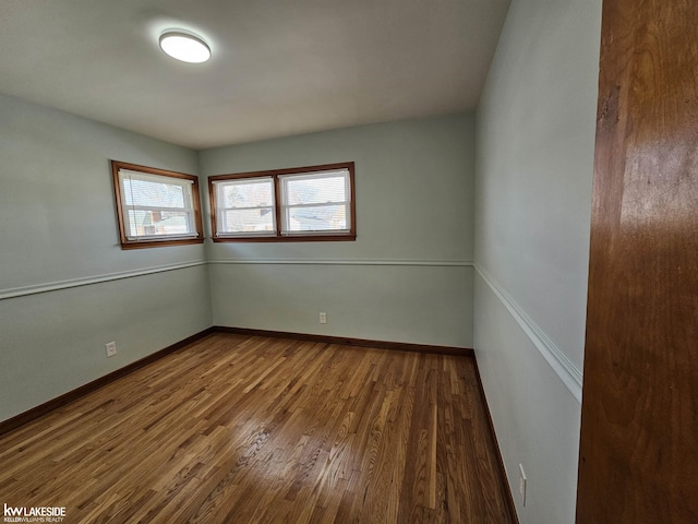 spare room with hardwood / wood-style flooring