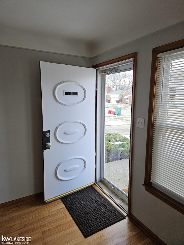 entryway with hardwood / wood-style flooring