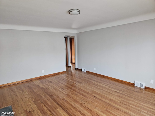 spare room with light wood-type flooring