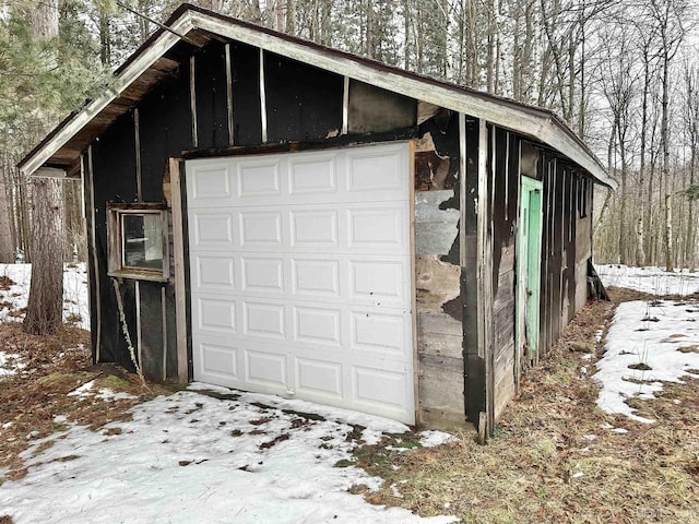 view of snow covered garage