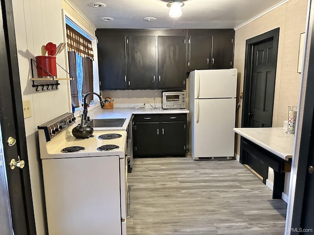 kitchen featuring crown molding, sink, white appliances, and light hardwood / wood-style flooring