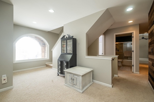 bonus room featuring light colored carpet