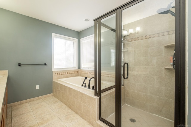 bathroom featuring vanity, separate shower and tub, and tile patterned floors