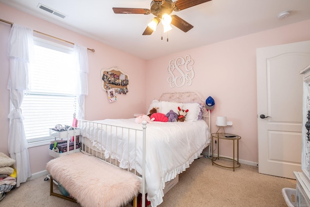 bedroom with light colored carpet and ceiling fan