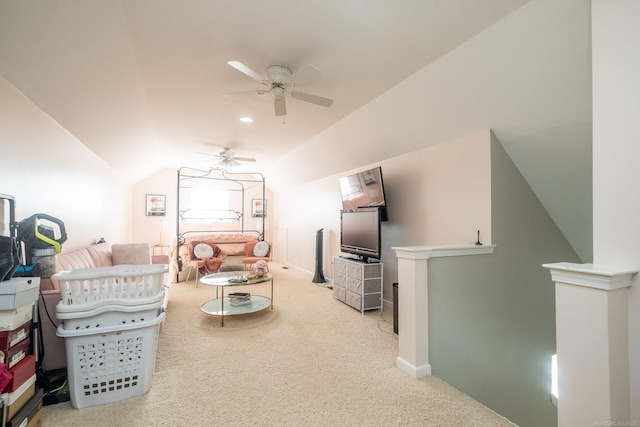 living room featuring vaulted ceiling, ceiling fan, and carpet flooring