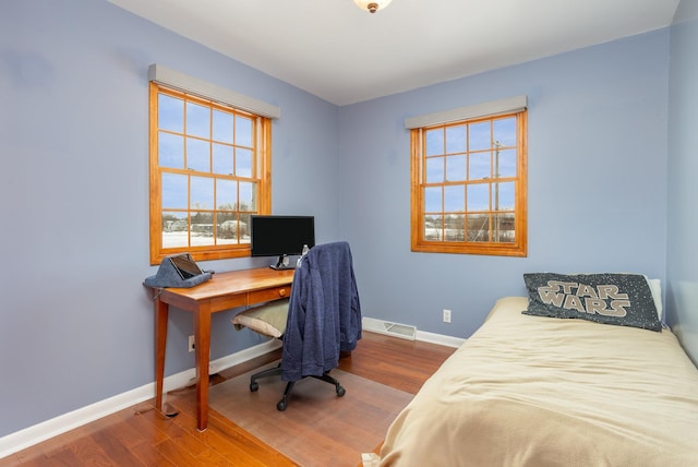 bedroom featuring hardwood / wood-style flooring