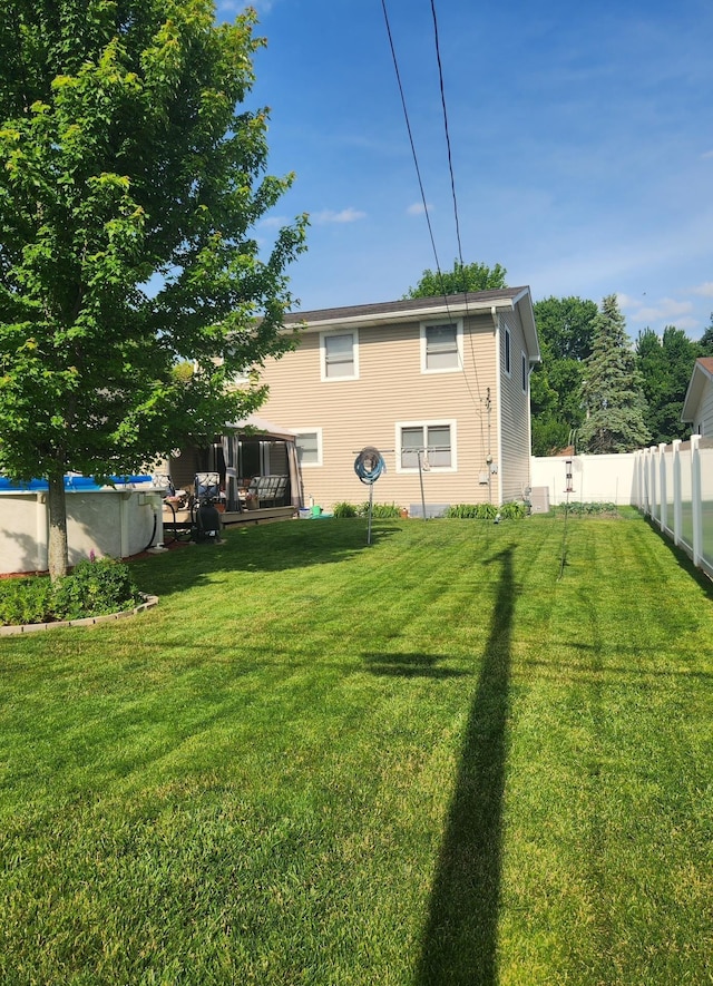 view of yard with a covered pool