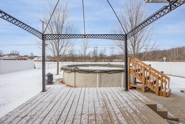 snow covered deck with a covered pool