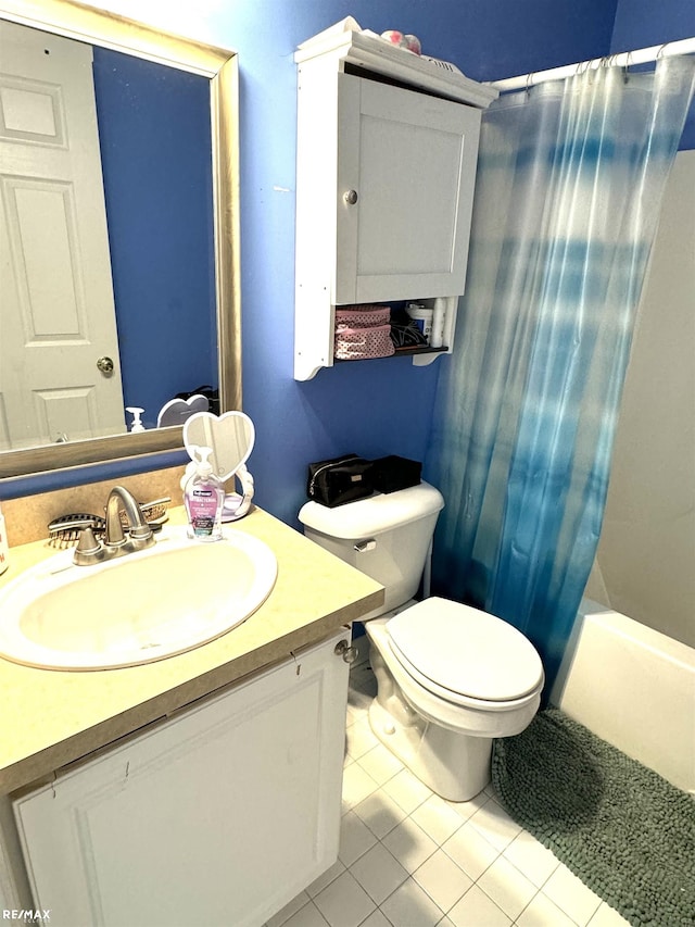 full bathroom with tile patterned flooring, vanity, shower / tub combo with curtain, and toilet