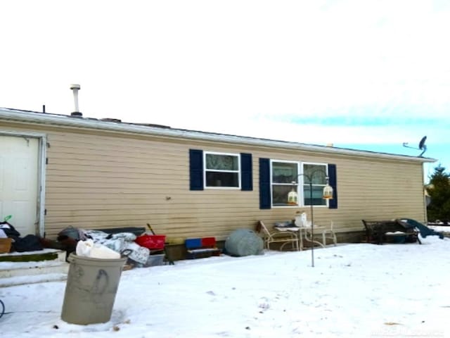 view of snow covered property