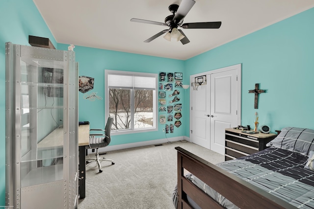 bedroom featuring light colored carpet, a closet, ceiling fan, and french doors