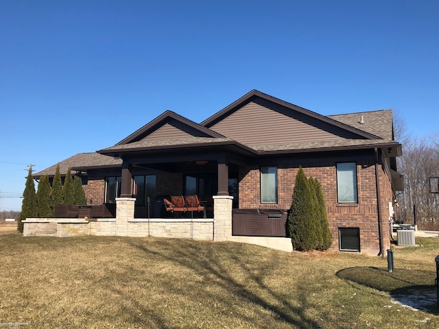 view of front facade with a front yard and a patio