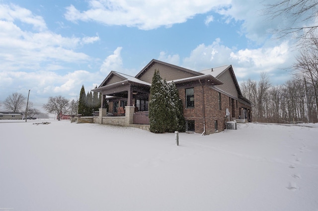 exterior space featuring cooling unit and covered porch