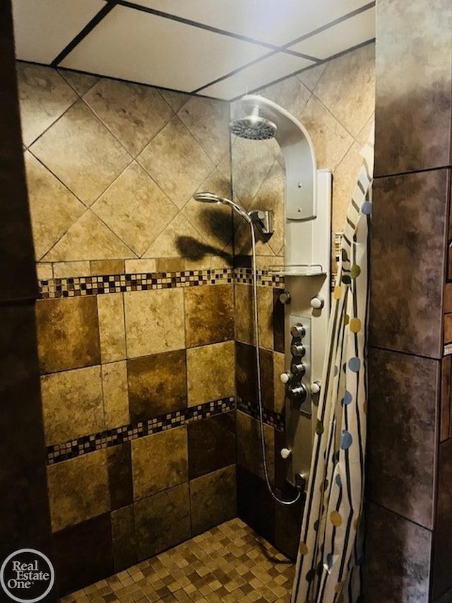 bathroom with a tile shower