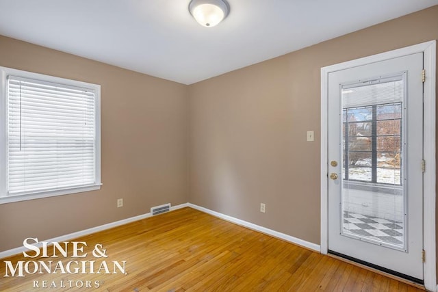 interior space with hardwood / wood-style flooring