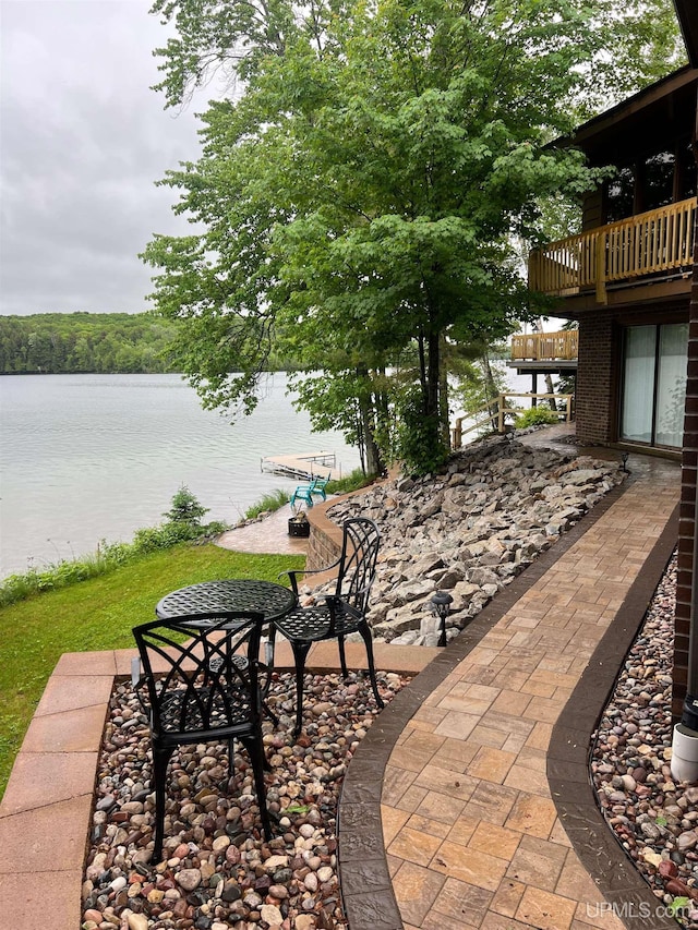 view of patio with a water view