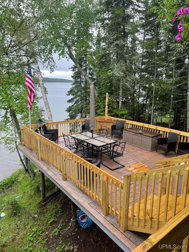 wooden terrace with a water view