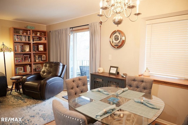 dining space with a chandelier