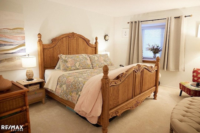 bedroom featuring light colored carpet