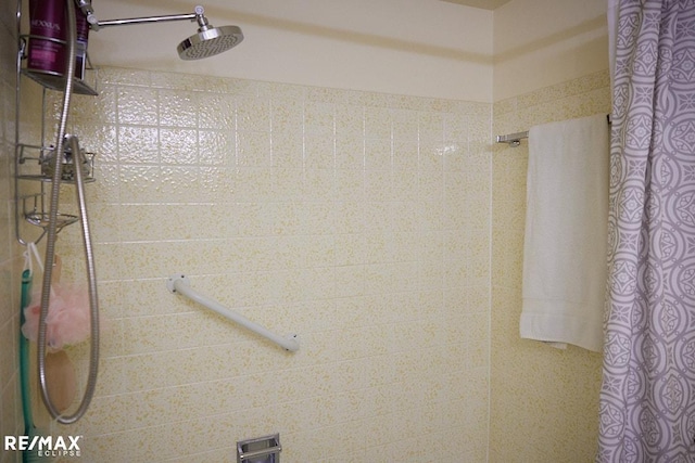 bathroom with a shower with curtain