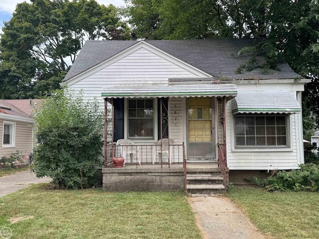 bungalow-style house featuring a front yard