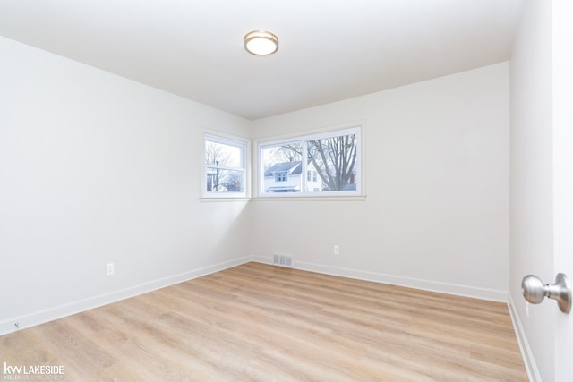 unfurnished room featuring light wood-type flooring