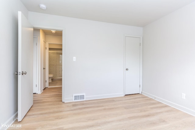 unfurnished room featuring light wood-type flooring