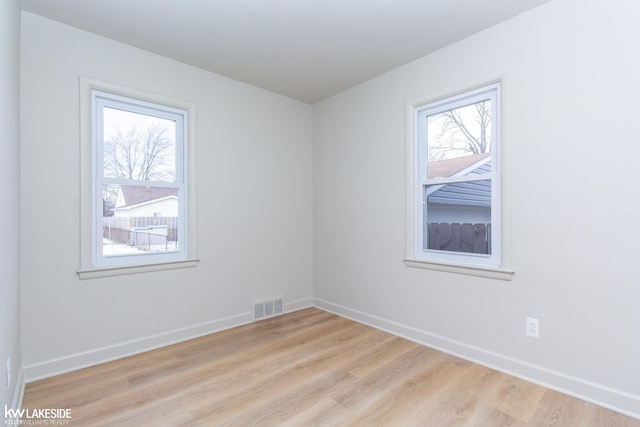 unfurnished room featuring light hardwood / wood-style flooring