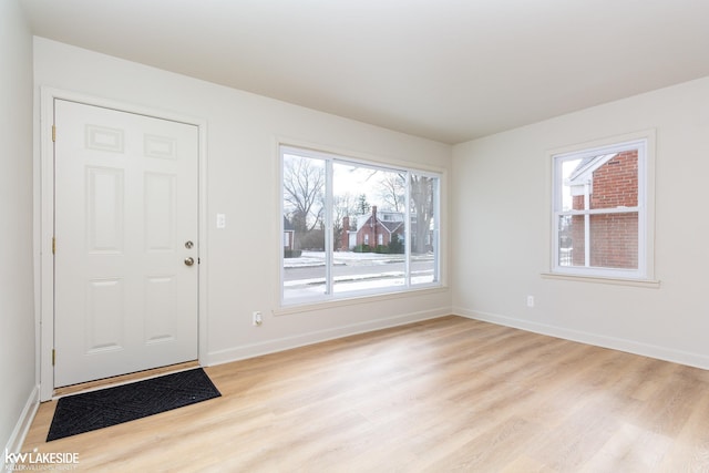 foyer with light wood-type flooring