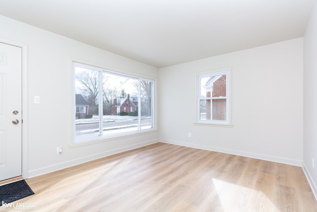 interior space with plenty of natural light and light hardwood / wood-style floors