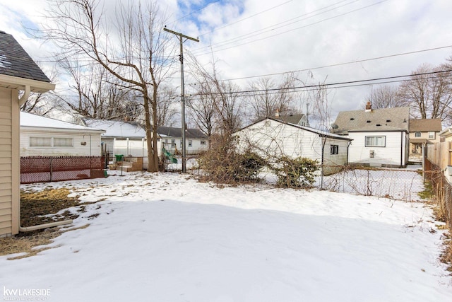 view of yard layered in snow