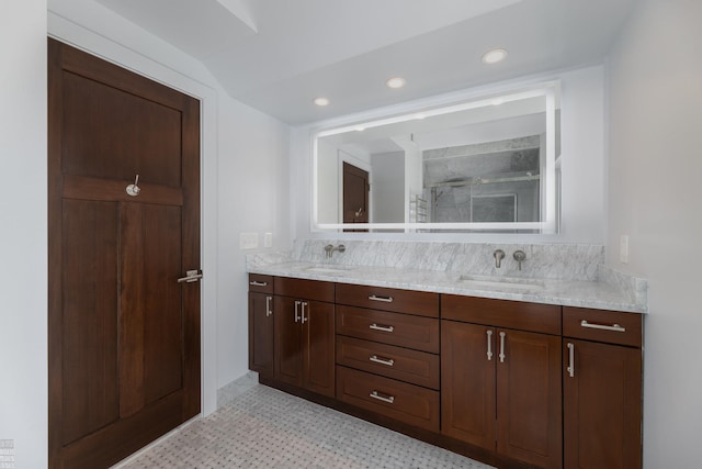 bathroom featuring vanity, lofted ceiling, and an enclosed shower