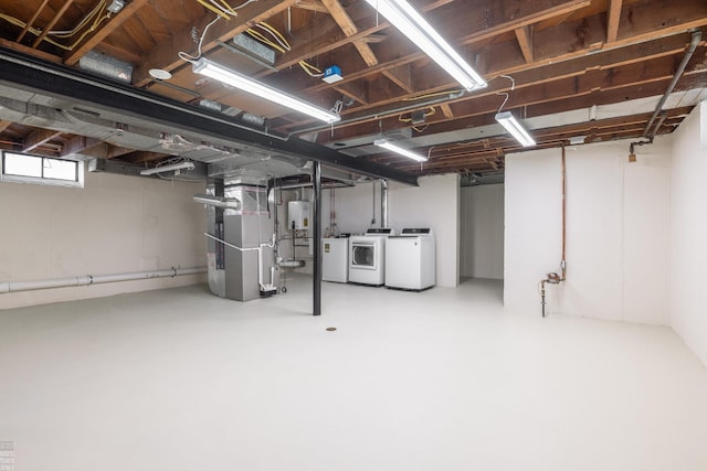 basement with separate washer and dryer, heating unit, and tankless water heater