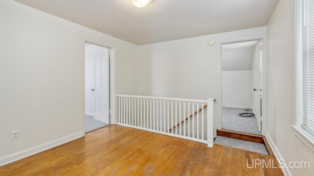 empty room featuring hardwood / wood-style flooring