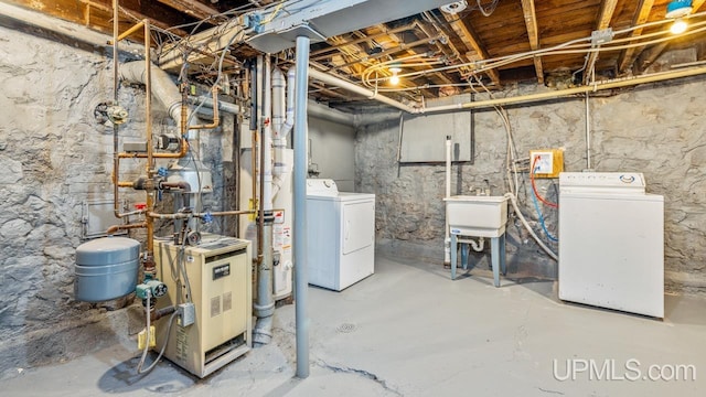 basement featuring sink and washing machine and dryer