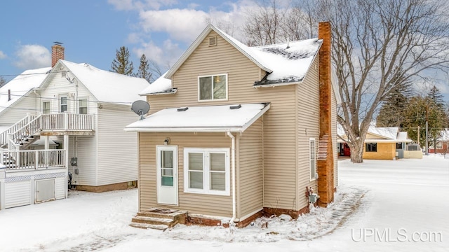 view of snow covered property