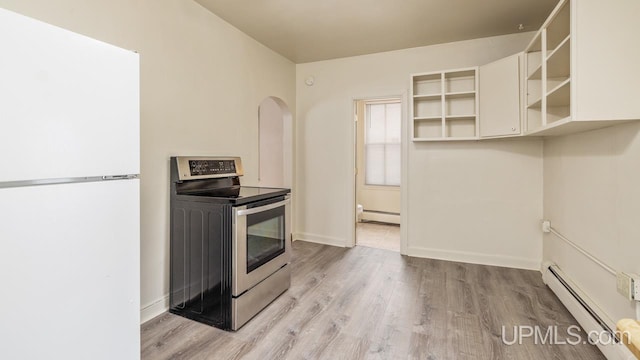 kitchen featuring stainless steel electric stove, white fridge, a baseboard heating unit, and light hardwood / wood-style flooring