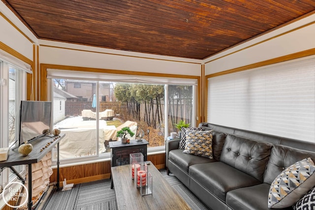 sunroom / solarium featuring wood ceiling and plenty of natural light