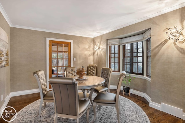 dining space featuring ornamental molding, a healthy amount of sunlight, and dark hardwood / wood-style floors